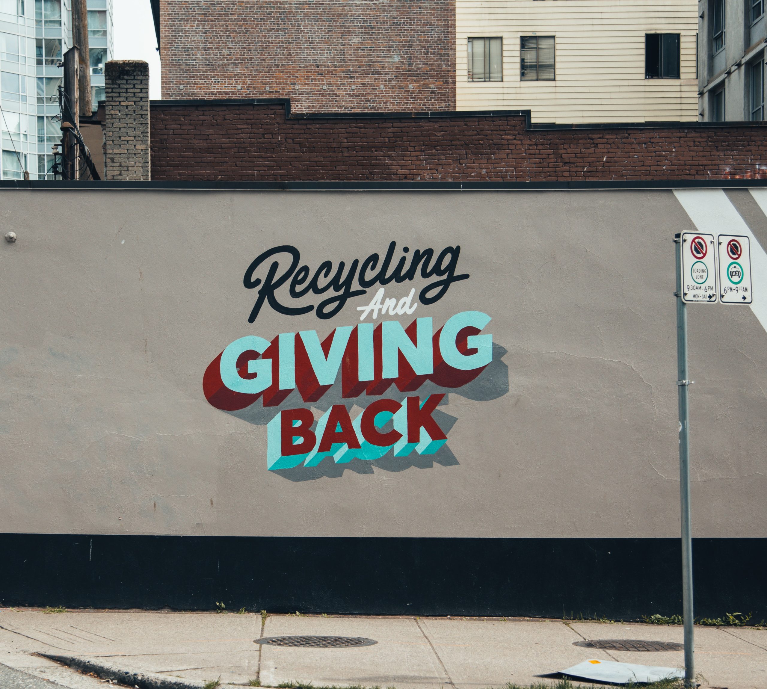 recycle graffiti on downtown city wall