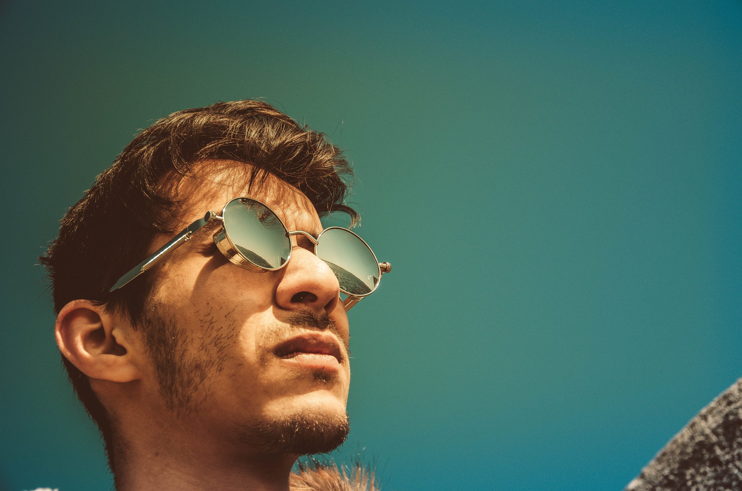 man in the summer sun wearing sunglasses